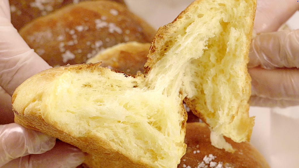 Glossy golden brioche buns soft and fluffy inside